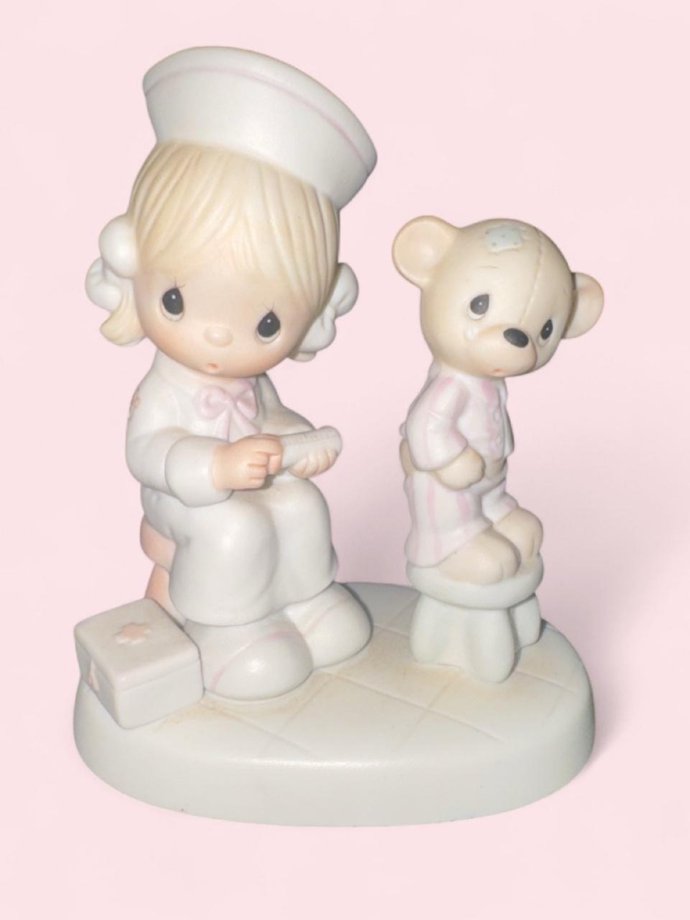 Precious Moments Pastel Pink and White Nurse Figurine with Teddy